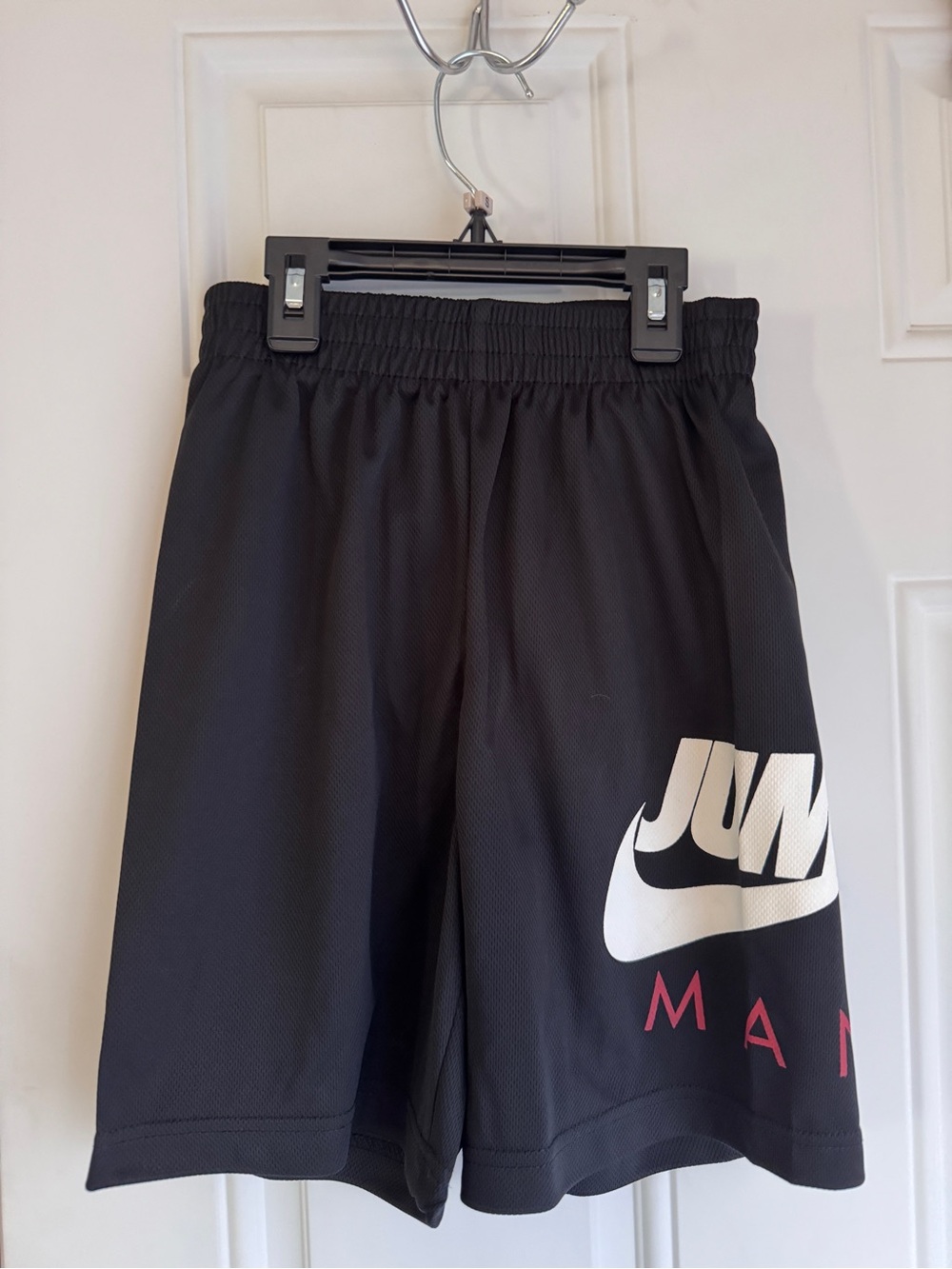 Air Jordan Boy’s Black Athletic Shorts with White Swoosh